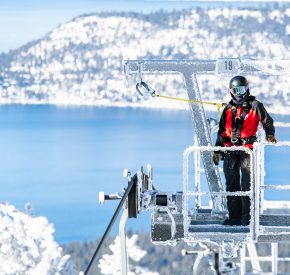female ski patroller on lift tower