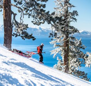 Ski patrol with toboggan at diamond peak with lake tahoe views