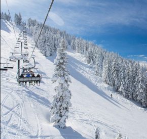 lakeview chairlift with snowy trees and lake tahoe views at diamond peak