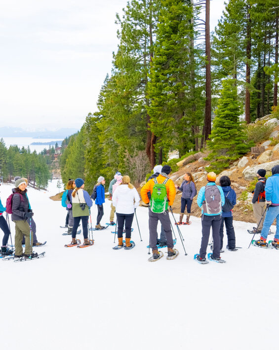 snowshoe hikers listen to naturalist