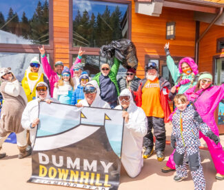 group in costume with diamond peak dummy downhill banner