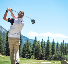 male golfer swings on driving range at Incline village championship golf course