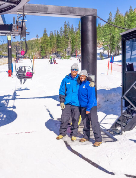 female and male lift operator smiling