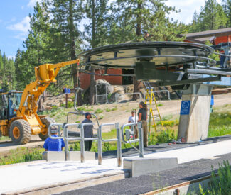 lift operations team working on a lift in the summer