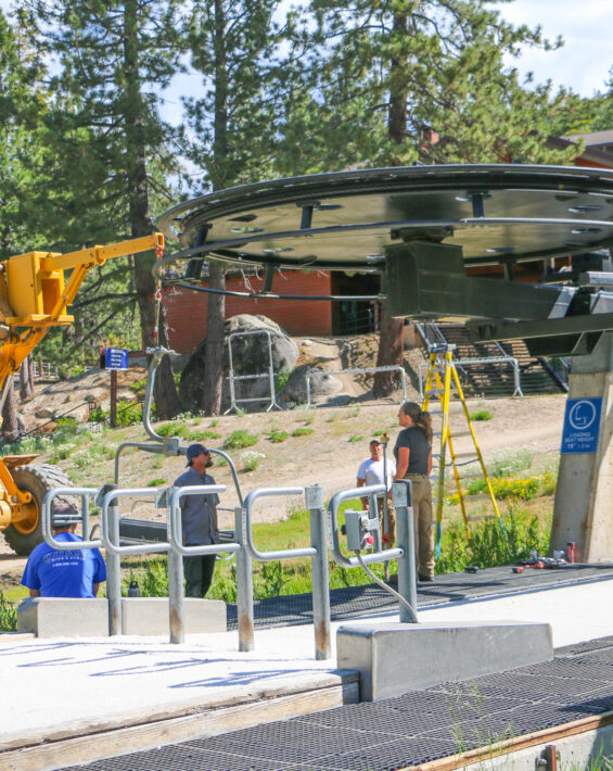 lift operations team working on a lift in the summer