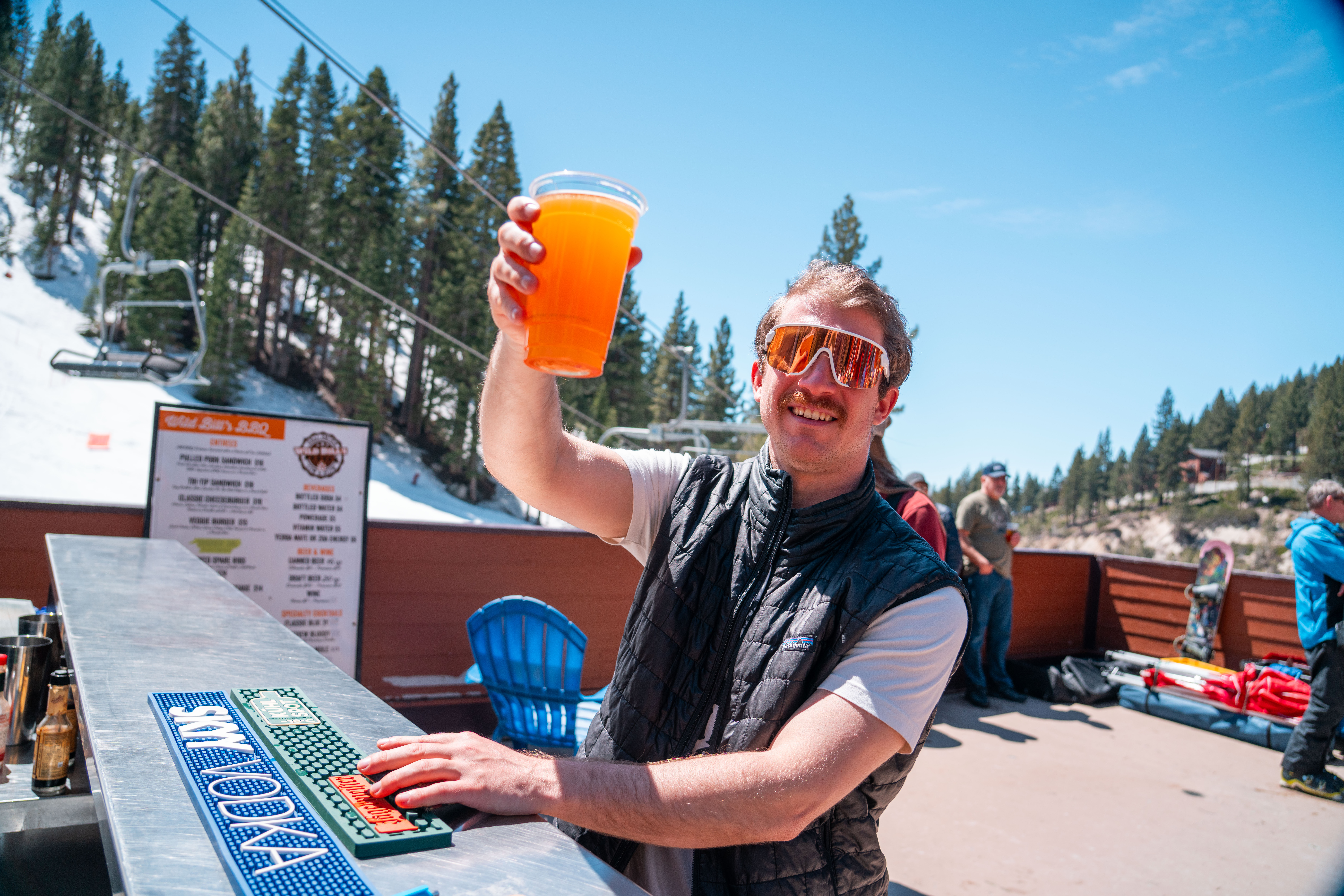man with beer on diamond peak deck