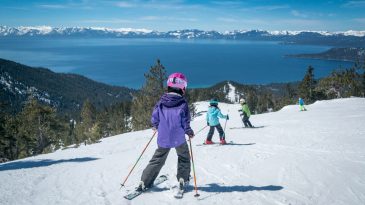 family skis down crystal ridge