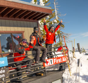 ski patrollers posing at ski patrol shack