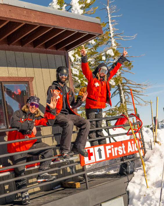 ski patrollers posing at ski patrol shack