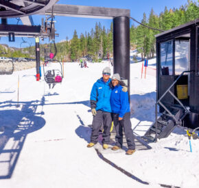 female and male lift operator smiling