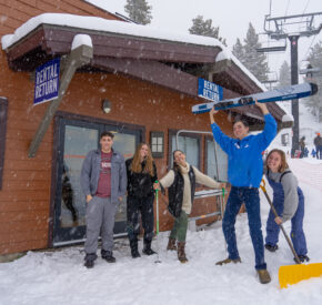 rental shop staff outside in snow