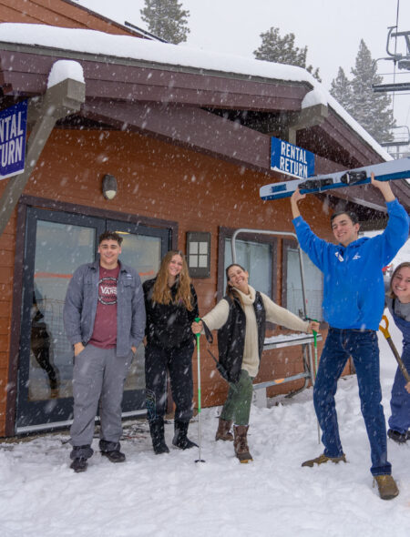 rental shop staff outside in snow