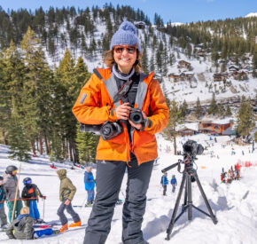 woman with cameras on ski slope during dummy downhill event