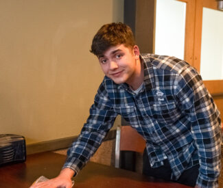 male employee cleans in ski lodge