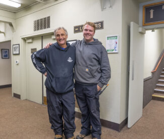 employees smile inside ski lodge