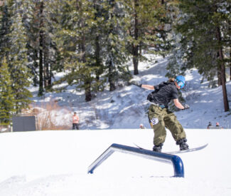 snowboarder on rail