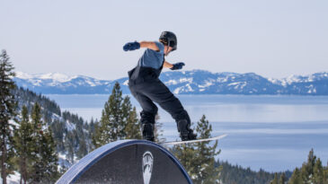 snowboarder on rail