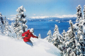 Patroller skiing powder