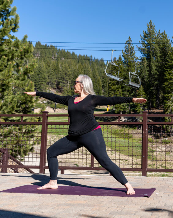 woman does yoga at diamond peak